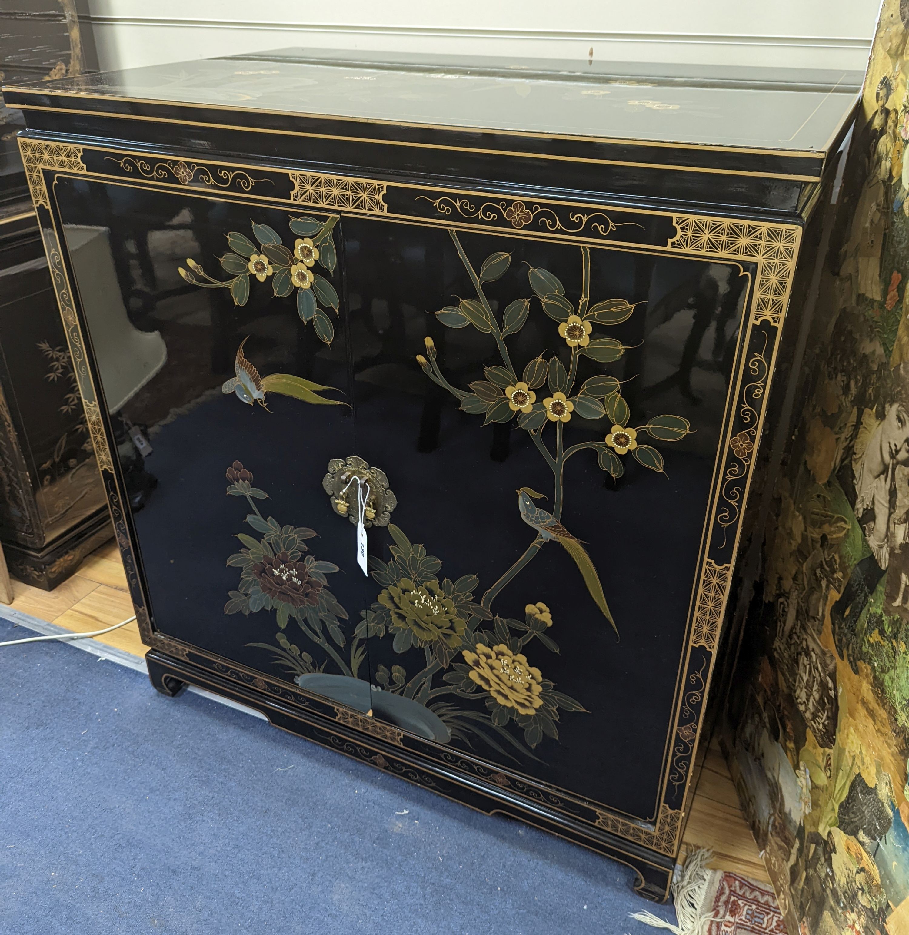 A Chinese lacquer media cabinet. W-94cm, D-61cm, H-102cm.